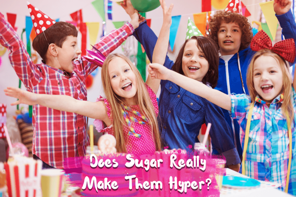 Group of children at a party with colorful hats and balloons, representing the myth that sugar makes kids hyperactive.