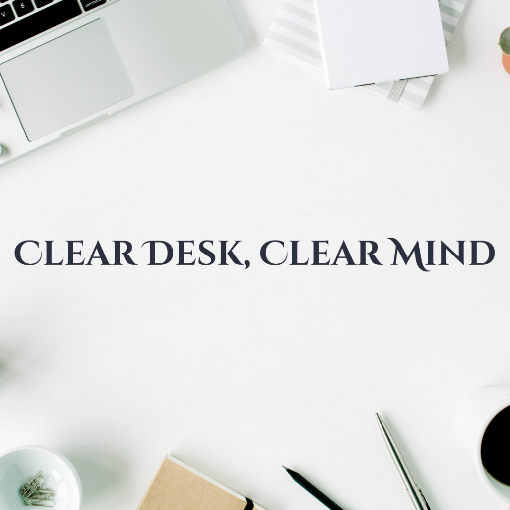 A clean desk with a laptop, a notebook, a pen, a cup of coffee, and a small bowl of paper clips. The text 'CLEAR DESK, CLEAR MIND' is displayed prominently in the center, highlighting the importance of maintaining a tidy workspace for better mental clarity and productivity.