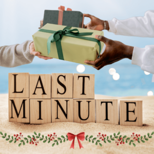 Two hands exchanging wrapped gifts, one with a green gift and green ribbon, and the other with a dark-colored gift and red ribbon, against a beach scene background with wooden blocks spelling 'LAST MINUTE' and holly decorations with a red bow representing last minute christmas gift ideas