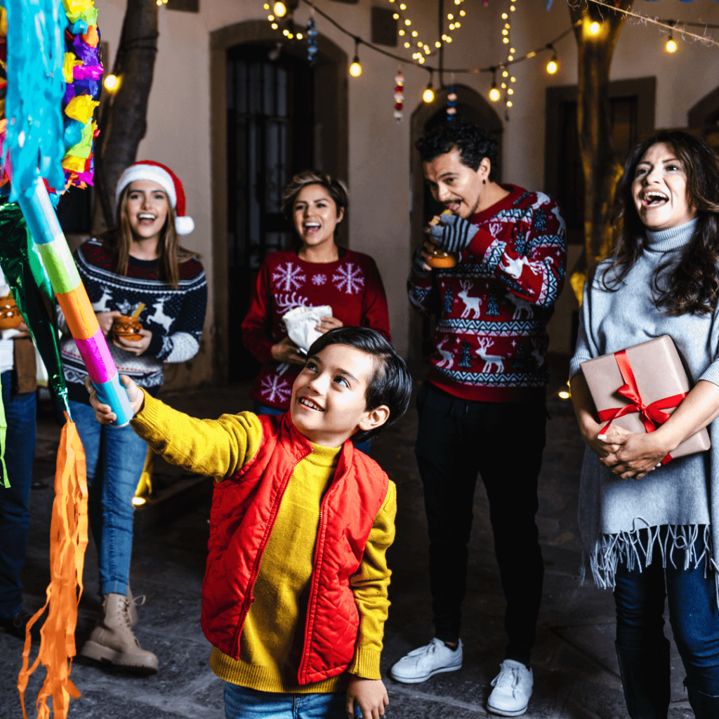 Festive scene of a Las Posadas celebration in Mexico, with people in traditional attire, a star-shaped piñata, and vibrant decorations