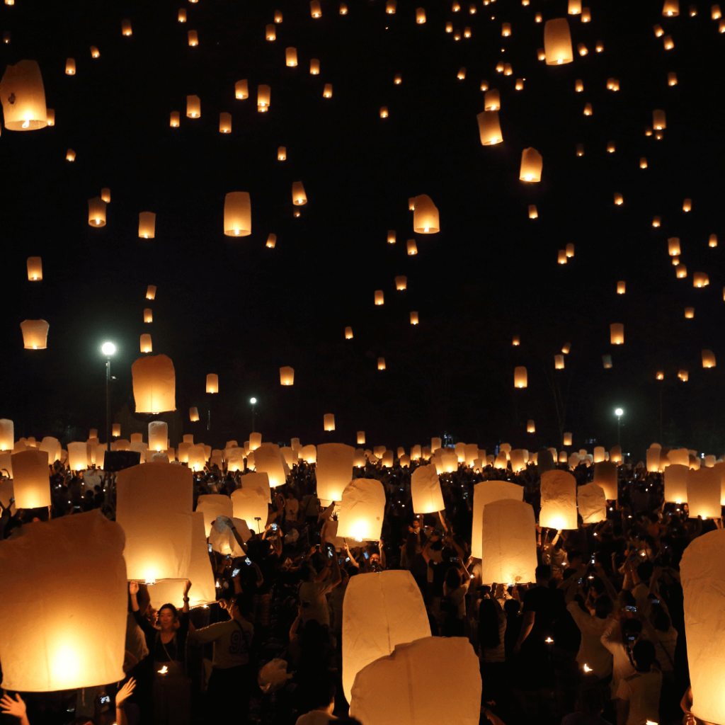 A vibrant display of giant lanterns, illuminated in various colors, creating intricate patterns, at the Giant Lantern Festival in the Philippines, symbolizing light and hope during the holiday season