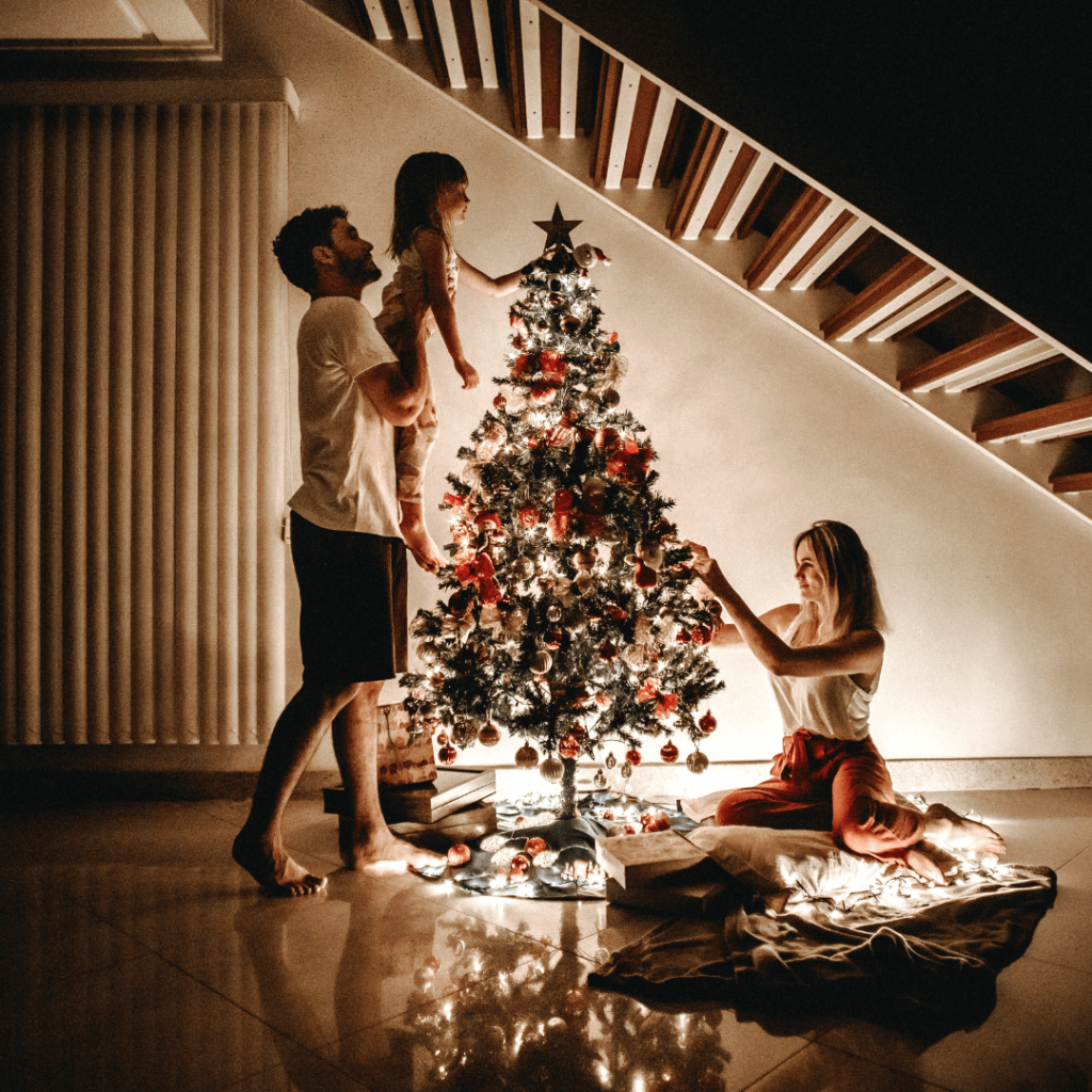 A beautifully decorated Christmas tree adorned with delicate spiderweb ornaments, reflecting a Ukrainian tradition symbolizing good luck and fortune